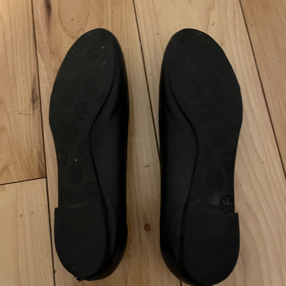 Tory Burch Black Flats with Gold Emblem - Picture 2 of 8